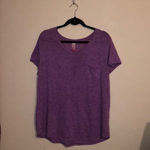 A lite purple v neck shirt